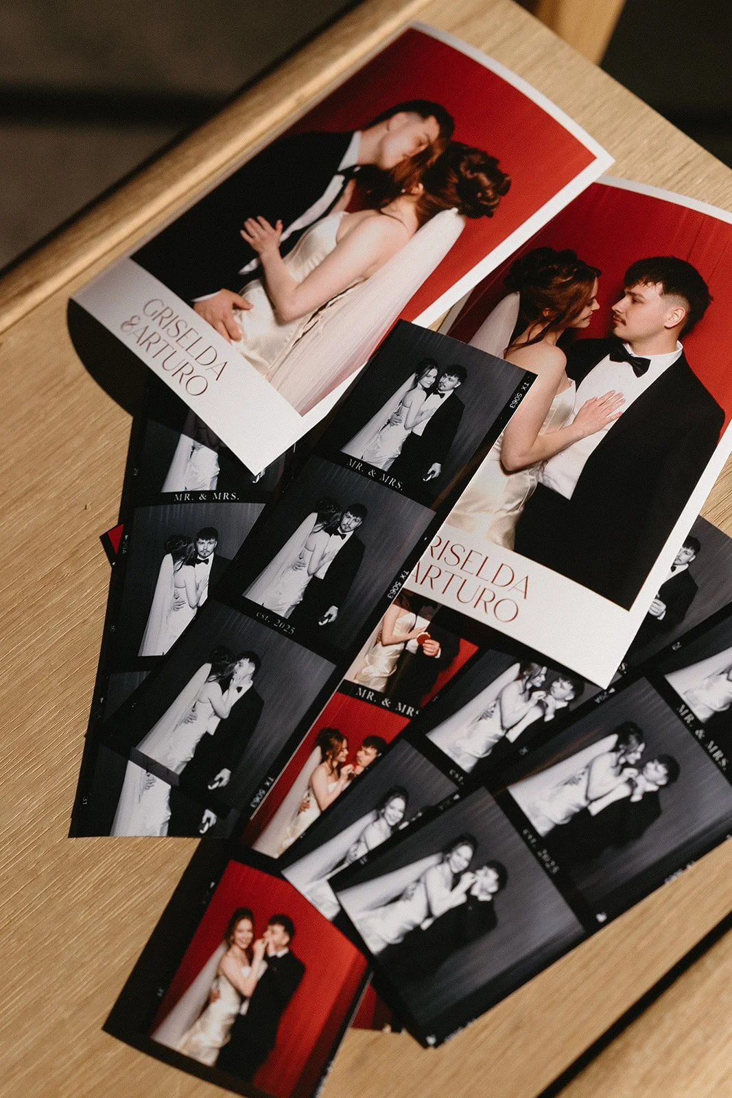 Elegant printed wedding photo strips with crimson backdrop